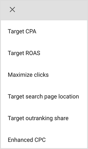 Ini adalah tangkapan layar dari menu opsi penargetan di Google Ads. Opsinya adalah Target CPA, Target ROAS, Maksimalkan klik, Target lokasi halaman penelusuran, Target melebihi pesaing, Enhanced CPC. Mike Rhodes mengatakan opsi penargetan cerdas di Google Ads menggunakan kecerdasan buatan untuk menemukan orang dengan niat yang tepat untuk iklan Anda.