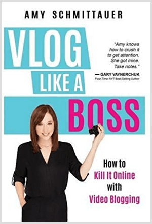 Amy Landino menulis buku Vlog Like a Boss dengan nama Amy Schmittauer. Sampulnya memperlihatkan foto Amy dari pinggang ke atas memegang kamera video. Judul muncul di latar belakang biru muda dengan huruf putih dan fuchsia. Tagline buku ini adalah Bagaimana Membunuhnya Secara Online Dengan Video Blogging.