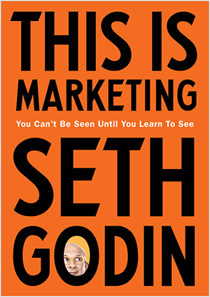 Ini adalah tangkapan layar dari sampul This Is Marketing oleh Seth Godin. Sampulnya berbentuk persegi panjang vertikal dengan latar belakang oranye dan teks hitam. Foto kepala Seth muncul di O nama belakangnya.