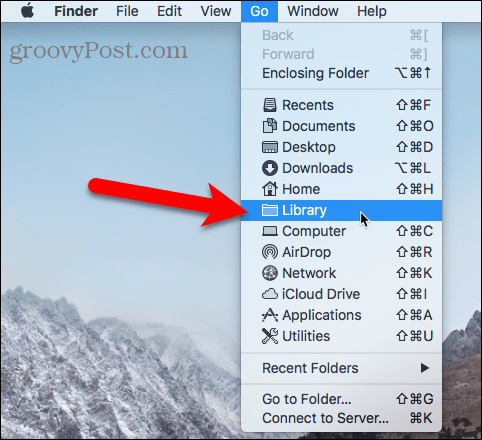 Akses folder Library menggunakan menu Go di Finder pada Mac